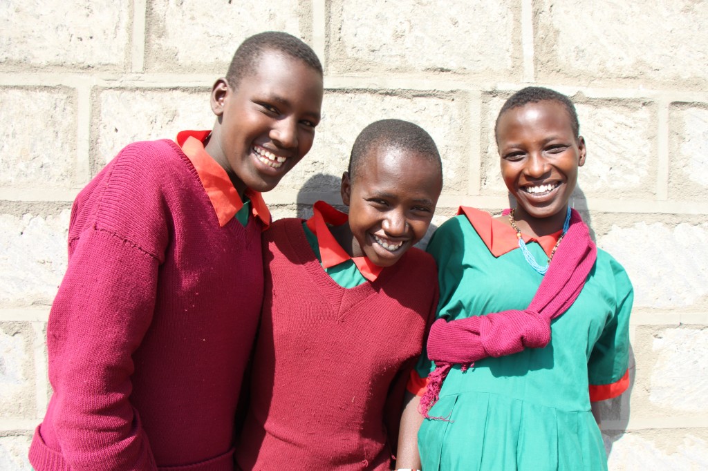 Three Samburu girls, who just found out they are receiving bursaries from PA-MOJA, which will help them avoid early marriage.